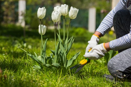 Landscapers sorting eco-friendly green waste for recycling in Hayes